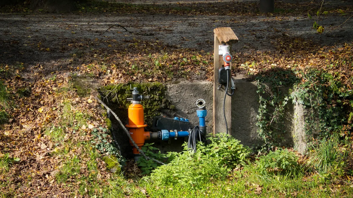 Drain Field Warning Signs by Severity — The Complete Guide yard pipe access with valves and utility box